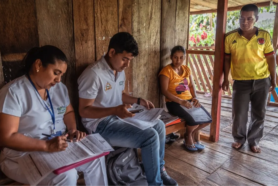 Marleny Mesa and her husband, Andrés Noscue, taking part in a verbal autopsy with members of the Colombia Rural Vital team after their son Eliad Noscue Mesa passed away. Weeks earlier, hospital staff had turned the family away from receiving care because Eliad lacked a civil registration number and birth certificate. Credit: Juan Arredondo for The New York Times