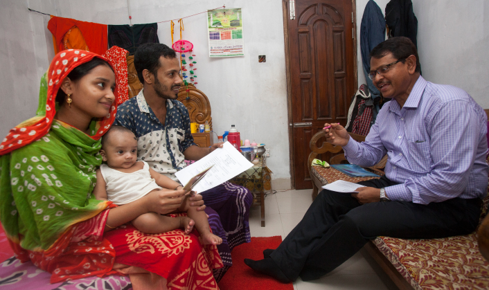 A family registering their baby’s birth.