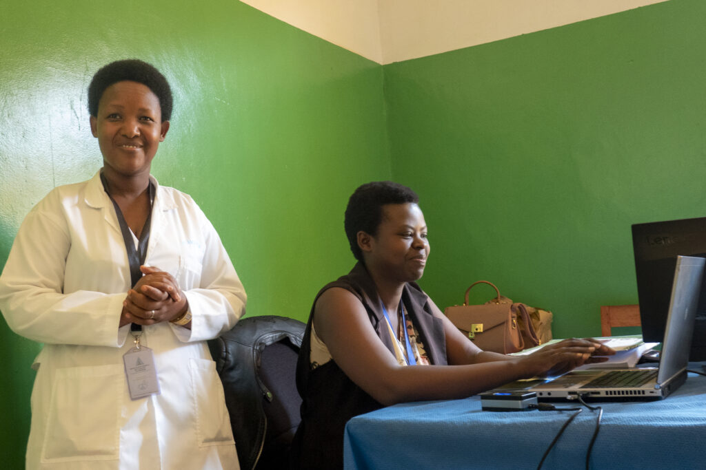 At a hospital in Kigali, Rwanda, two staff enter birth and death registration data into a computer.